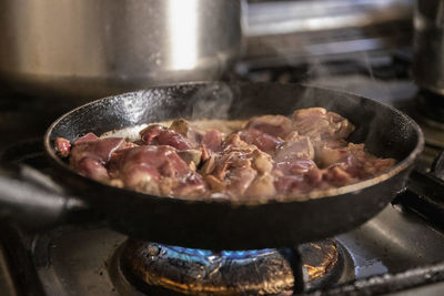 Close-up of meat in cooking pan