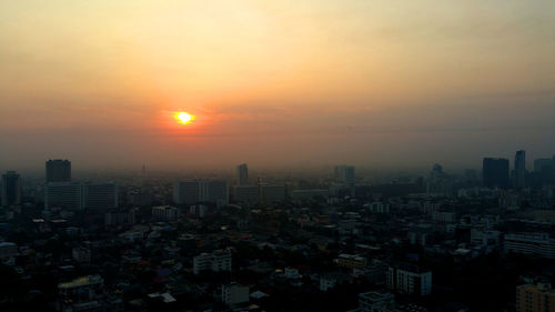 Cityscape against sky during sunset