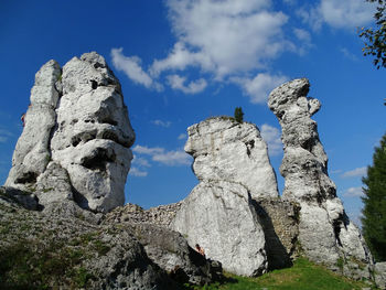 Low angle view of rock formation against sky