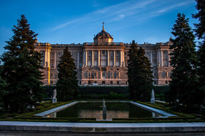 View of fountain building against sky