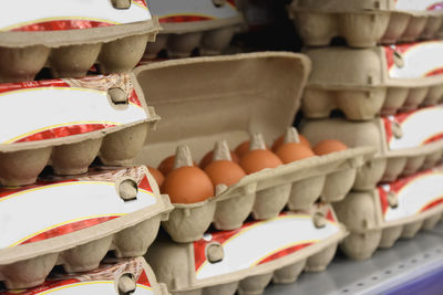 Cardboard box with eggs on a shelf in a supermarket. shopping for the upcoming easter.