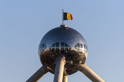 Low angle view of lighthouse against clear blue sky