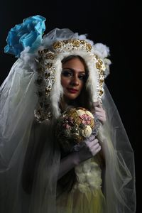 Portrait of young woman with bouquet