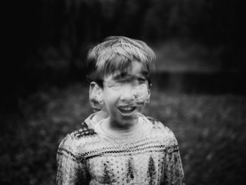 Blurred motion of boy standing outdoors