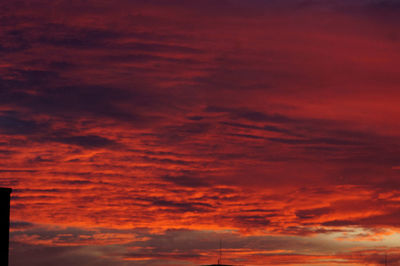 Low angle view of dramatic sky at sunset