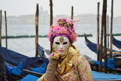 Close-up of man wearing mask in sea