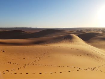 Scenic view of desert against clear sky