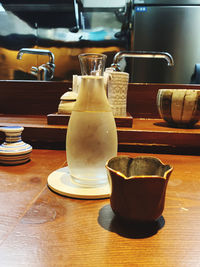 Close-up of coffee cups on table