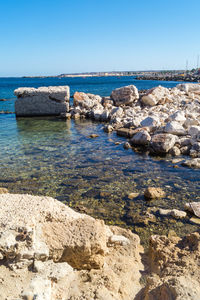 Scenic view of sea against clear blue sky