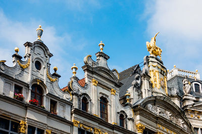 Low angle view of historical building against cloudy sky