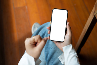 Midsection of woman using mobile phone