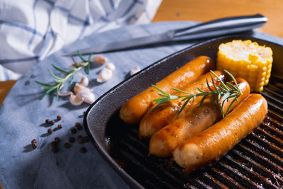 Close-up of sausages in cooking pan