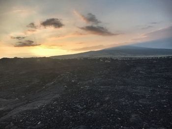 Scenic view of landscape against sky during sunset