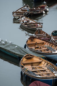 High angle view of boats moored at harbor