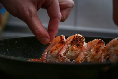 Close-up of person preparing food