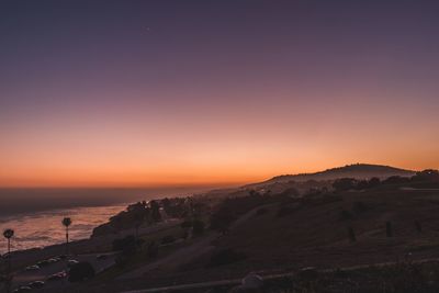 Scenic view of sea against clear sky during sunset