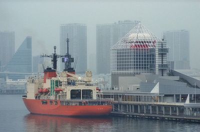 View of nautical vessel at harbor in city