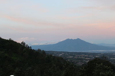 Scenic view of mountains against sky during sunset