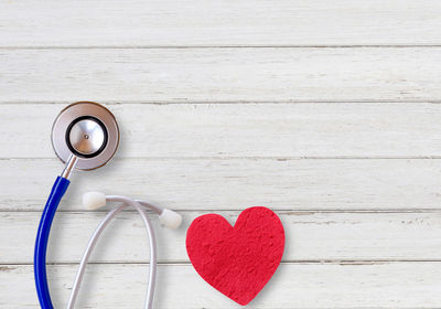Directly above shot of stethoscope on wooden table