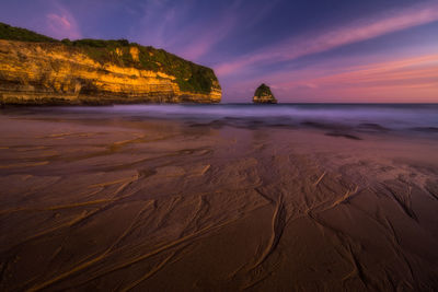 View of beach at sunset