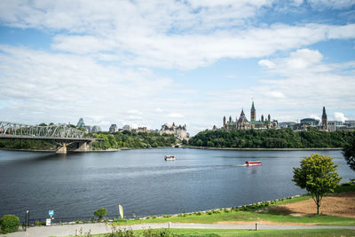 View of bridge over river with city in background