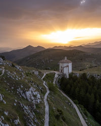 Scenic view of mountains against sky during sunset