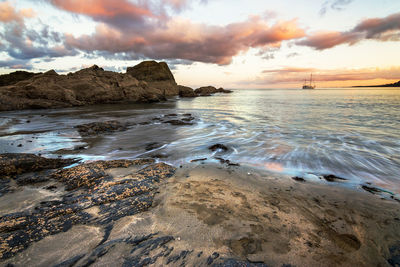 Scenic view of sea against sky at sunset