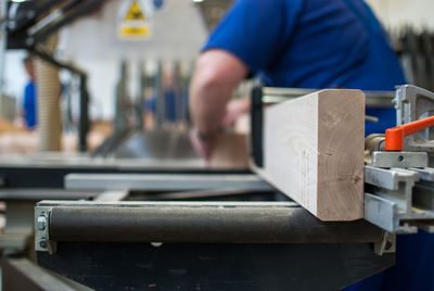 Midsection of man working in workshop