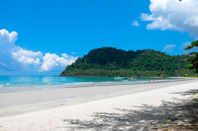 View of beach against cloudy sky