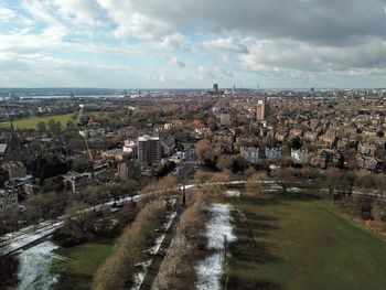 High angle view of river amidst buildings in city