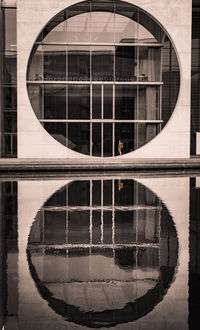 Reflection of building on glass window