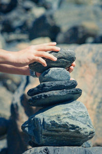 Close-up of person holding rock