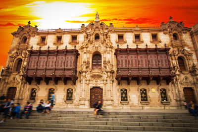 Low angle view of historic building against sky during sunset