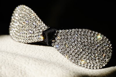 Close-up of stone on table against black background