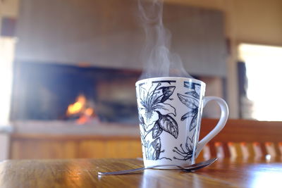Close-up of coffee cup on table