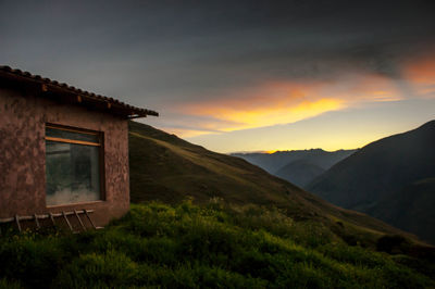 Scenic view of mountains against sky at sunset