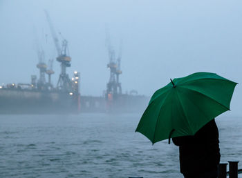 View of sea against sky during rainy season