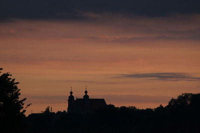 Silhouette of built structure at sunset