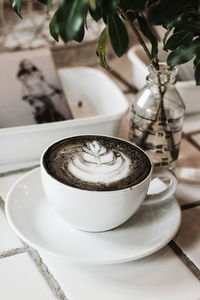 Close-up of coffee cup on table