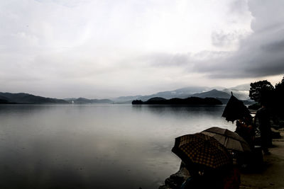 Scenic view of sea against cloudy sky