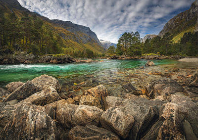 Scenic view of sea against mountain range