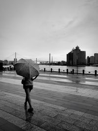 Rear view of a woman walking on the beach