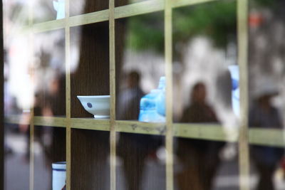 Reflection of woman on glass window