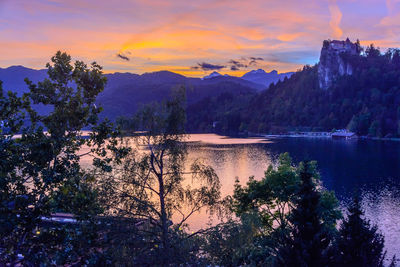 Scenic view of lake against sky during sunset