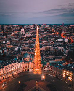 High angle view of illuminated cityscape against sky at night