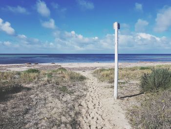 Scenic view of sea against blue sky