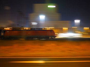 Blurred motion of cars on road in city at night