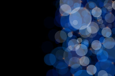 Defocused image of illuminated lights at night