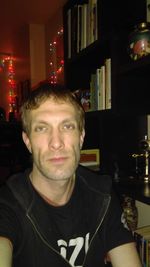 Portrait of young man sitting at home