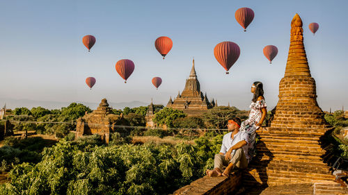 Low angle view of hot air balloons against sky